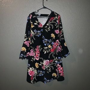 Knee length dress. Black with flowers.